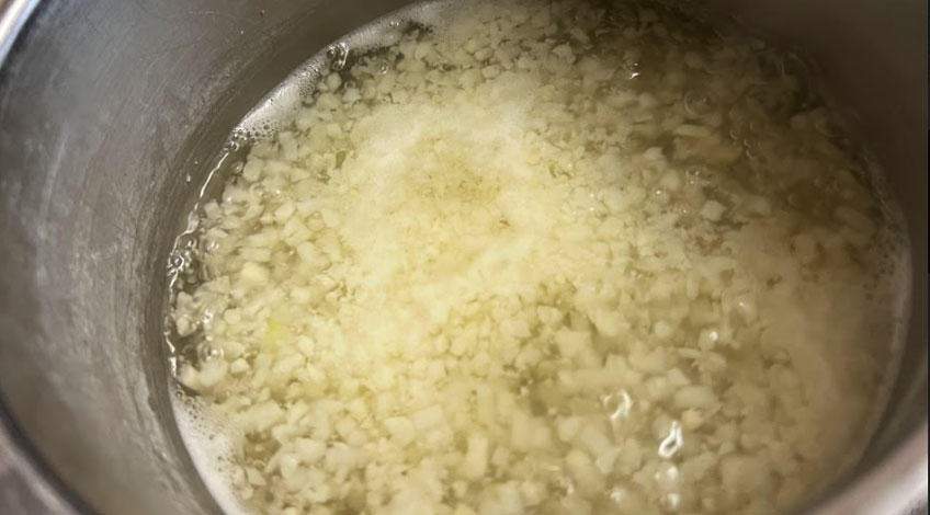 Cauliflower Rice Boiling In Pan On Stove