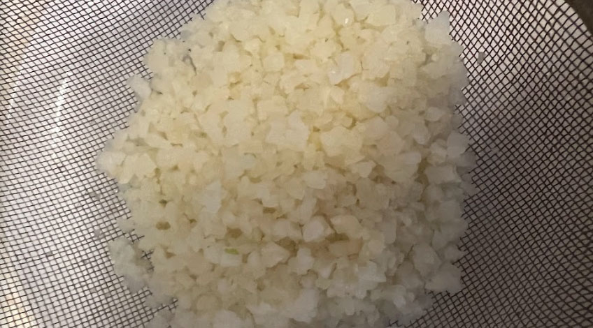 Cauliflower Rice in sieve