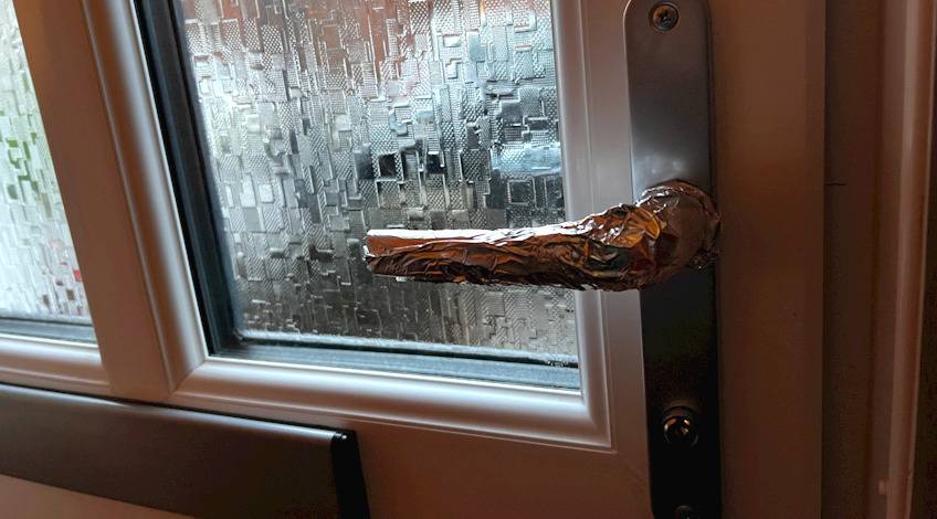 Door handle wrapped in tin foil
