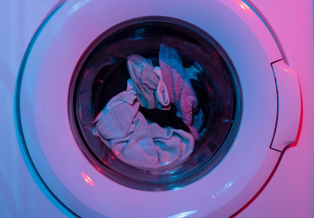 A washing machine with clothes in it