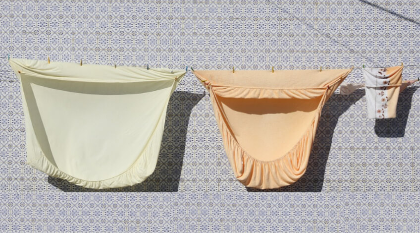 bedding hanging on clothesline