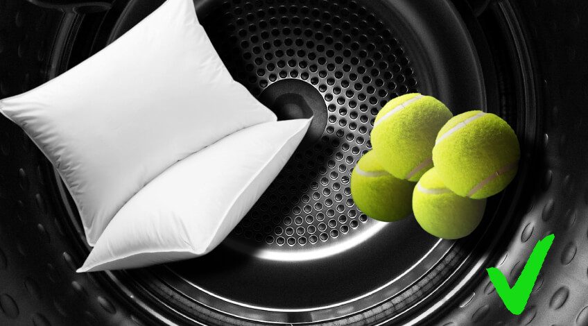 pillows and tennis balls inside dryer
