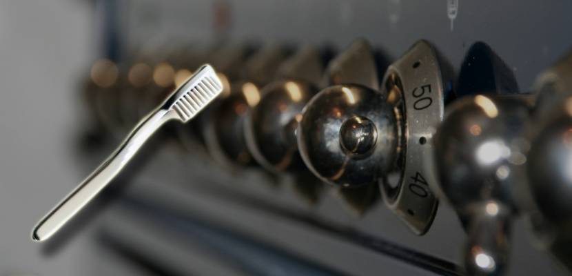 cleaning an oven with a toothbrush