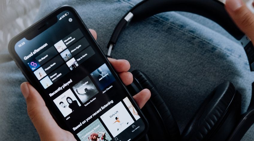 person playing music on a smartphone