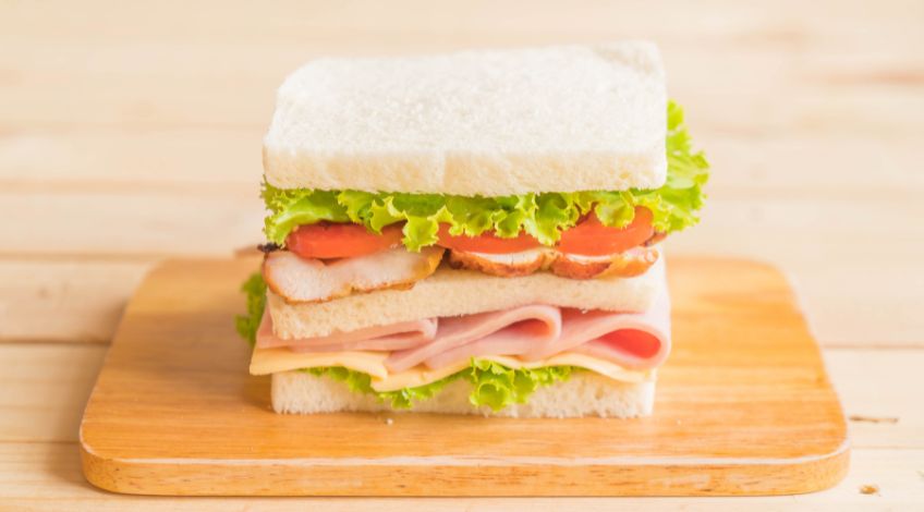 sandwich with lettuce tomatoes and ham
