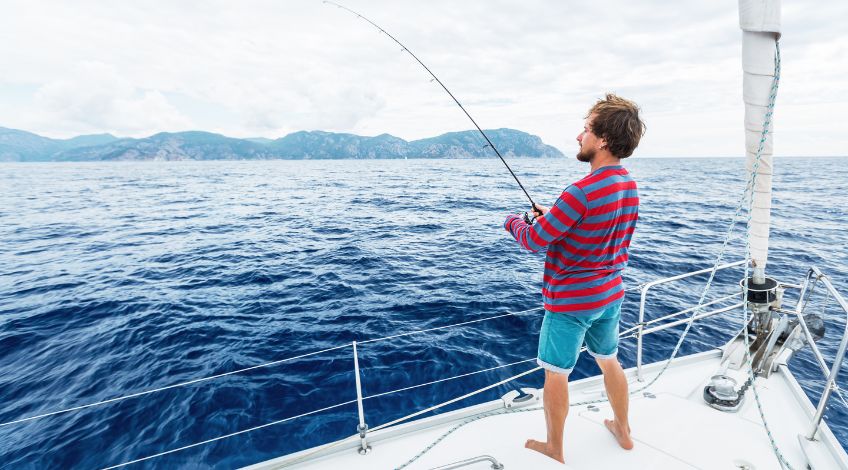 person fishing on a boat