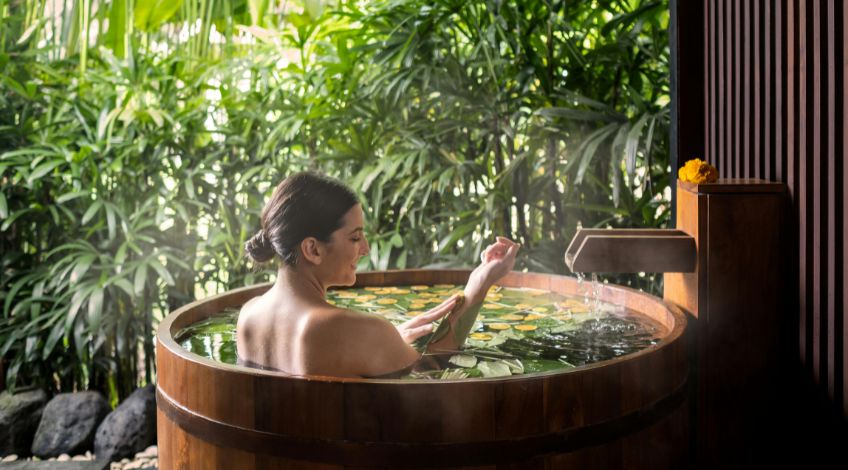 relaxing woman enjoying spa bath